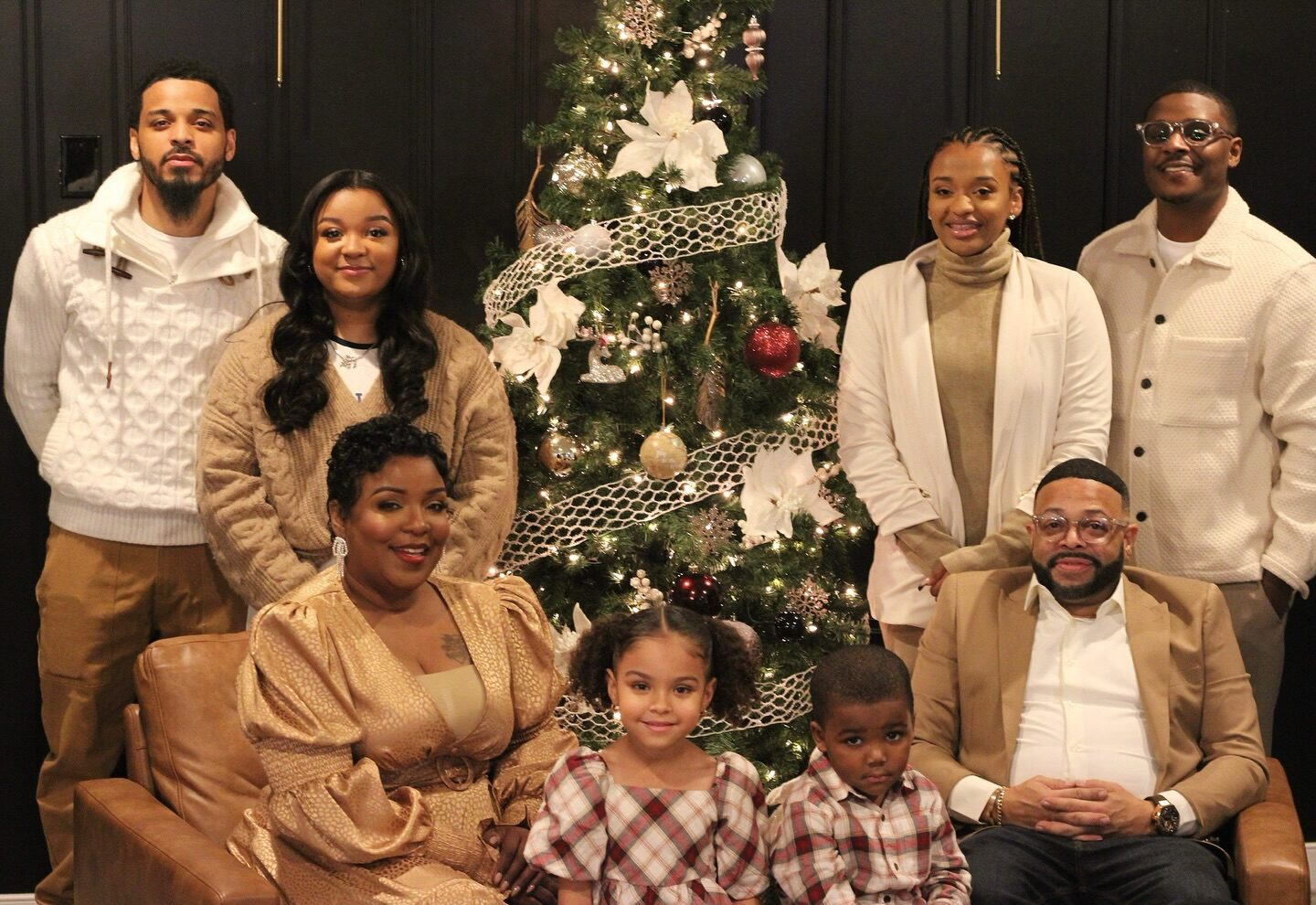 The Stith family gathered around a Christmas tree